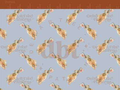 Watercolor bunnies on a pastel blue background seamless pattern scale digital file for small shops that make handmade products in small batches.