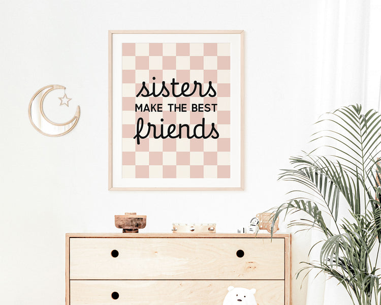 Sisters Make The Best Friends Instant Download Digital File featuring cursive script and block lettering in black on a blush pink and off white checkered background. Perfect for Twin Baby Girls Nursery Decor, Toddler Girls Shared Bedroom Decor or Little Girls Playroom Wall Art.