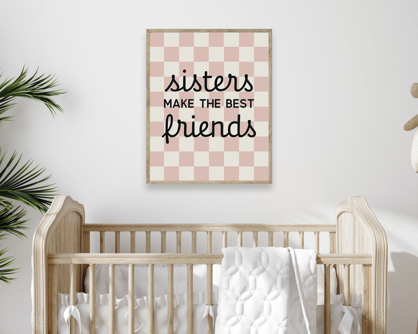 Sisters Make The Best Friends Instant Download Digital File featuring cursive script and block lettering in black on a blush pink and off white checkered background.