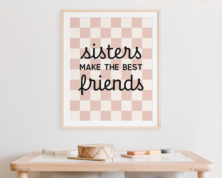Sisters Make The Best Friends Instant Download Digital File featuring cursive script and block lettering in black on a blush pink and off white checkered background. Perfect for Twin Baby Girls Nursery Decor, Toddler Girls Shared Bedroom Decor or Little Girls Playroom Wall Art.