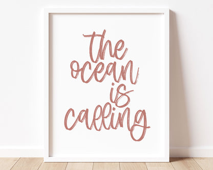 Dusty Rose colored The Ocean Is Calling Printable Wall Art featuring a textured brush style cursive lettered quote.