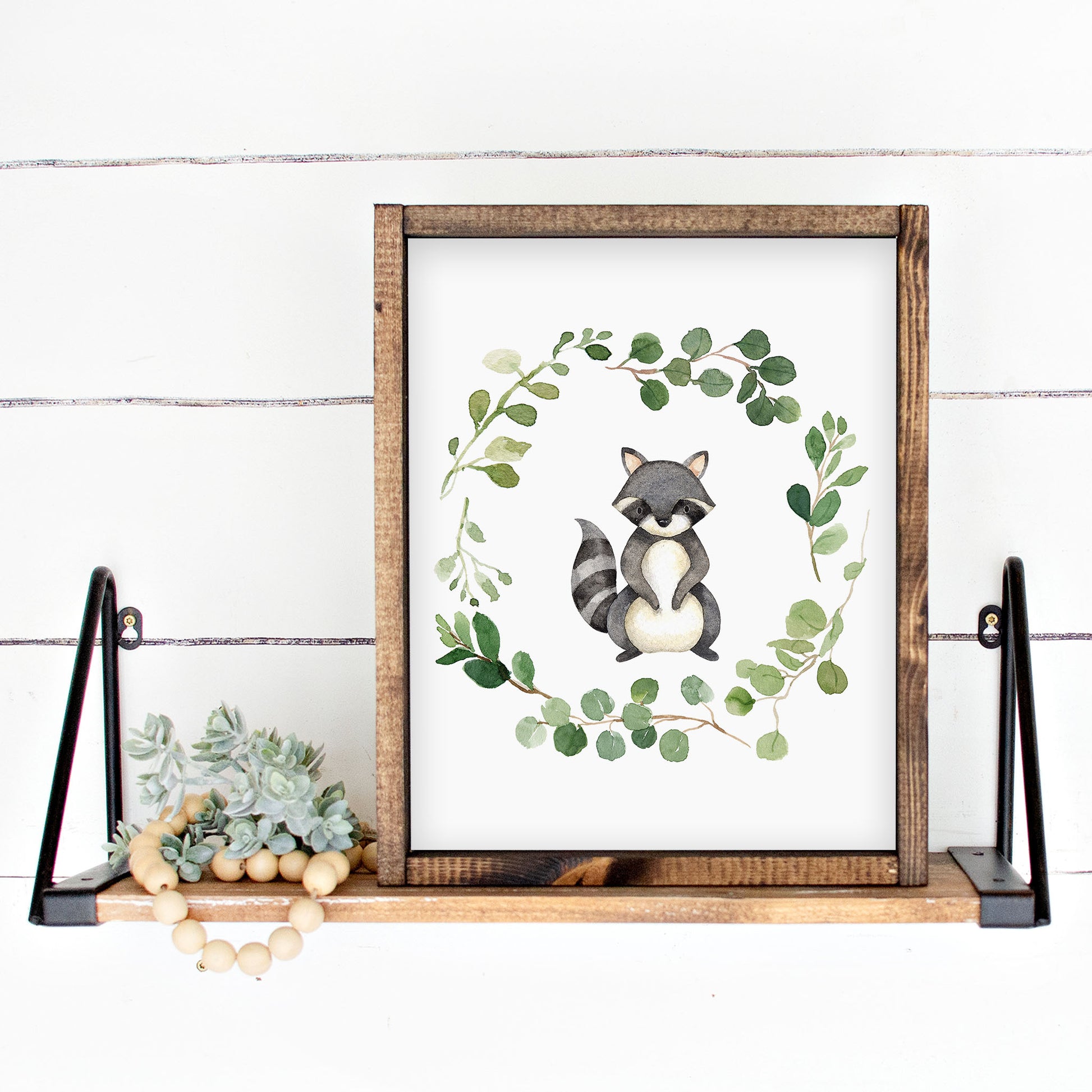 Watercolor Raccoon in a Greenery Eucalyptus Wreath Printable Wall Art perfect for Gender Neutral Woodland Nursery Decor or Kids Room Decor for boys or girls.