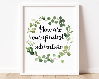 "You are our greatest adventure" quote in cursive lettering inside a Watercolor Greenery Eucalyptus Wreath Printable Wall Art. Great for Baby Boy or Baby Girl Nursery Decor or Kids Room Wall Hangings.