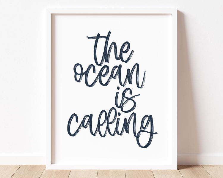 Navy Blue The Ocean Is Calling Printable Wall Art featuring a textured brush style cursive lettered quote perfect for Baby Boy Nautical Nursery Decor, Baby Girl Surf Nursery Wall Art, Nautical Kids Bedroom Decor or Children's Coastal Wall Art.