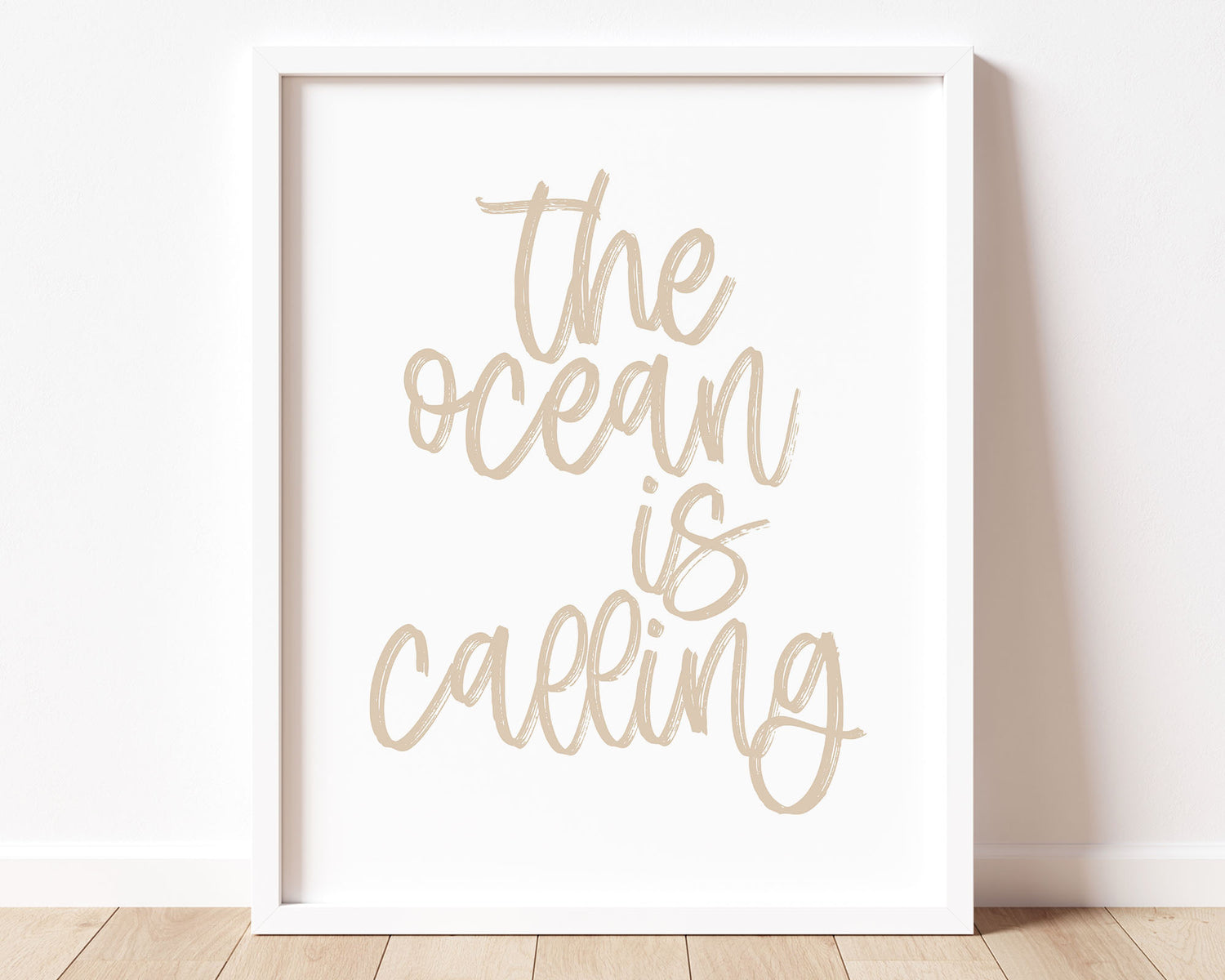 Neutral Tan The Ocean Is Calling Printable Wall Art featuring a textured brush style cursive lettered quote perfect for Baby Boy Nautical Nursery Decor, Baby Girl Surf Nursery Wall Art, Nautical Kids Bedroom Decor or Children's Coastal Wall Art.