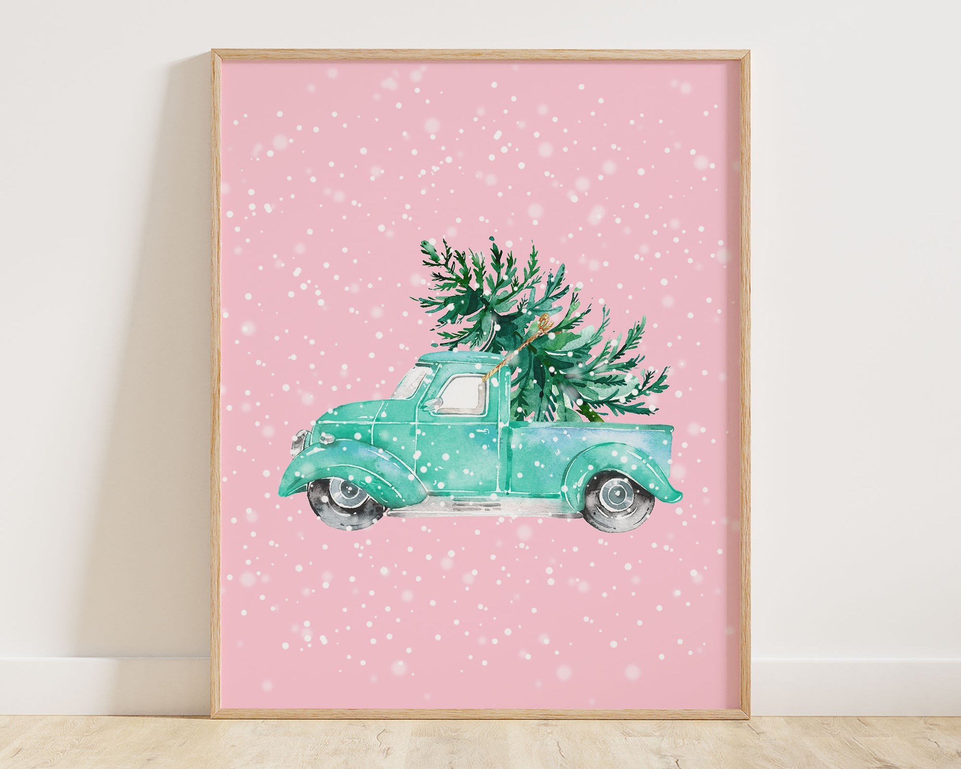 Watercolor Teal / Turquoise Vintage Christmas Truck with Christmas Tree on a pink background with a dreamy snowflake effect. This digital wall print is perfect for decorating bright and retro 1950s - 1960s spaces for a vintage Christmas aesthetic.
