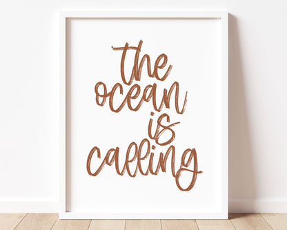 Rust Clay Terracotta earth tone colored The Ocean Is Calling Printable Wall Art featuring a textured brush style cursive lettered quote.