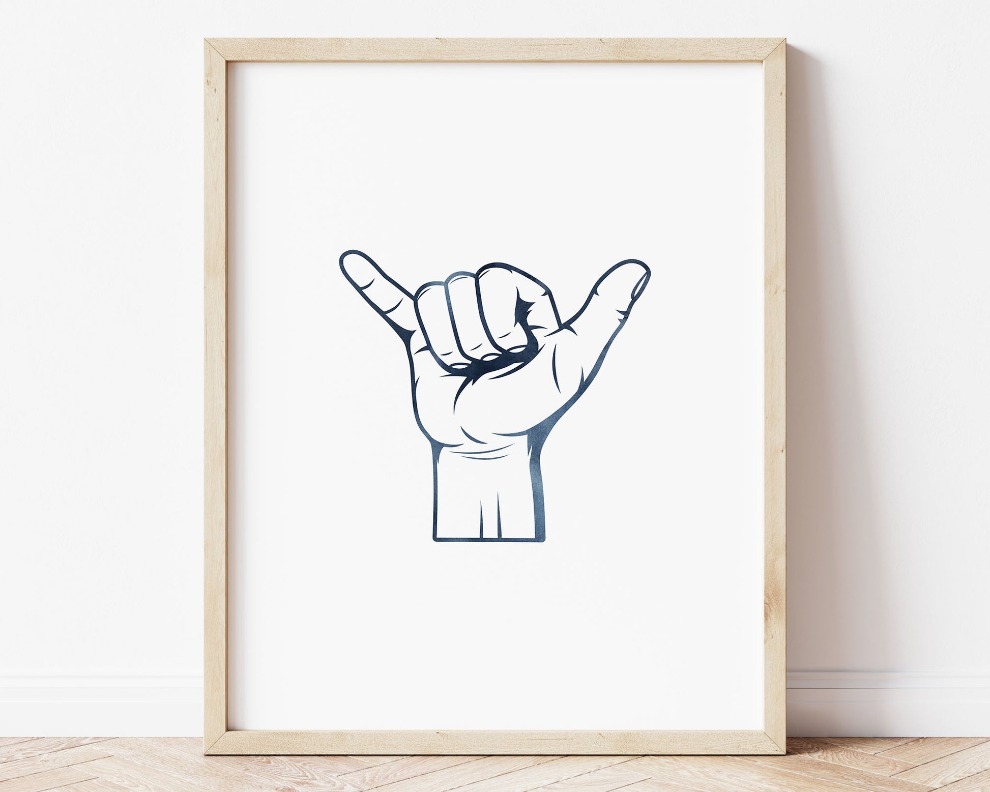 Watercolor Shaka Printable Wall Art featuring navy blue watercolor illustration of shaka hang loose hand sign. Perfect for Baby Boy Surf Nursery Decor, Baby Girl Surf Nursery Wall Art, Kids Coastal Bedroom Decor, Children's Beach Bathroom Wall Art or Hawaii Wall Art Playroom Decor.