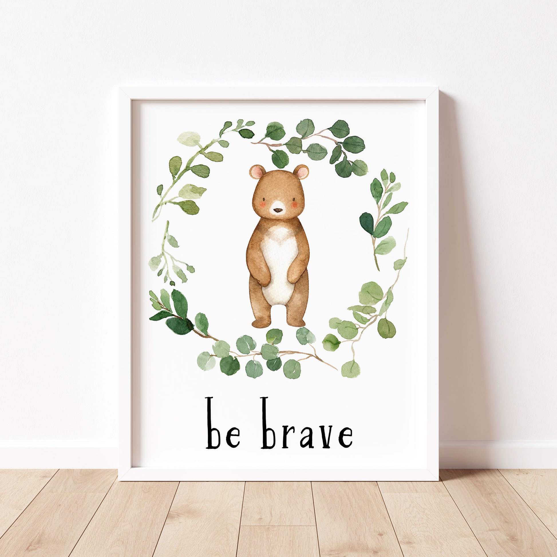 Watercolor Bear in a Eucalyptus Greenery Wreath with inspirational quote 'Be Brave ' in black lowercase lettering. Gender neutral instant download digital wall art print.