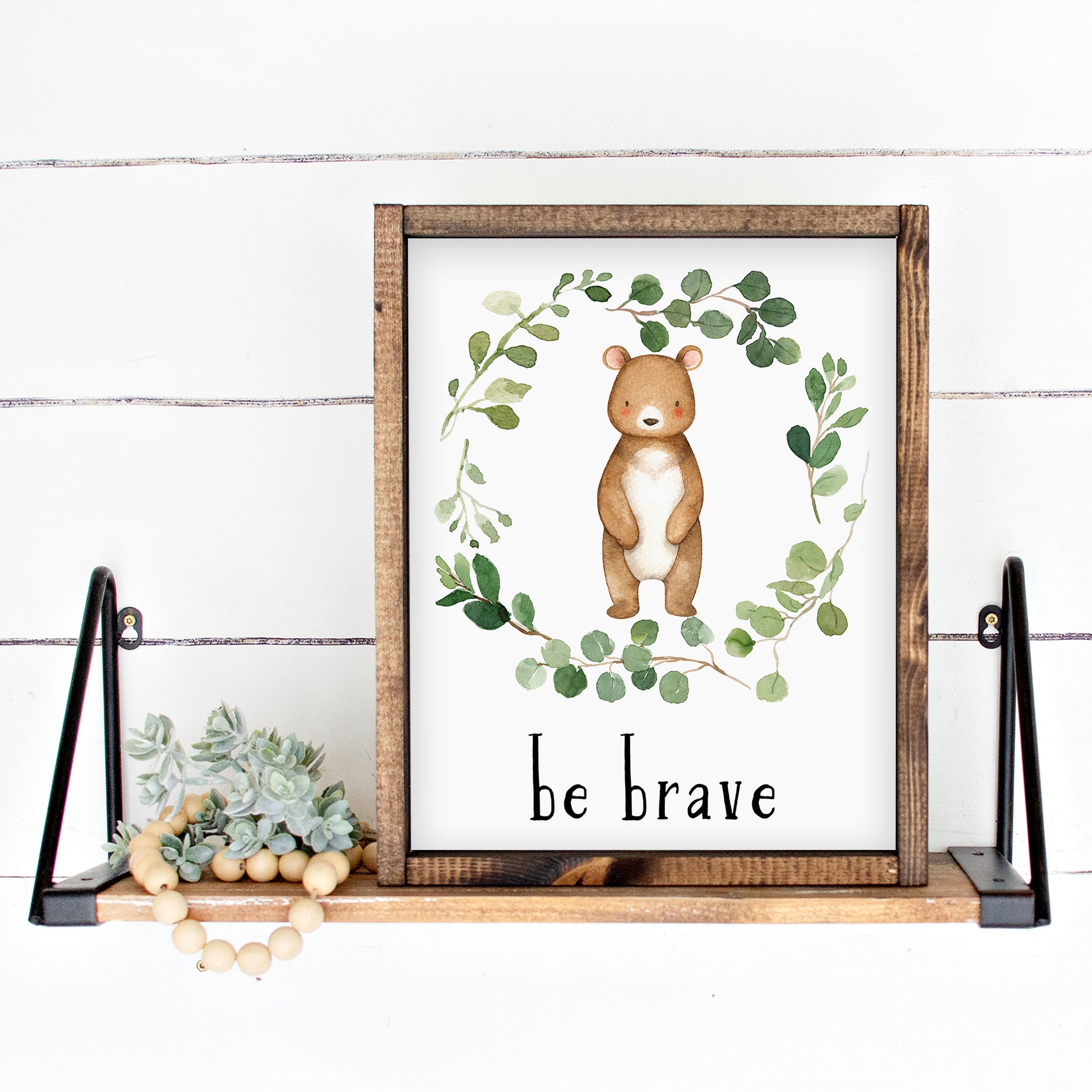 Watercolor Bear in a Eucalyptus Greenery Wreath with inspirational quote 'Be Brave ' in black lowercase lettering. Gender neutral instant download digital wall art print.