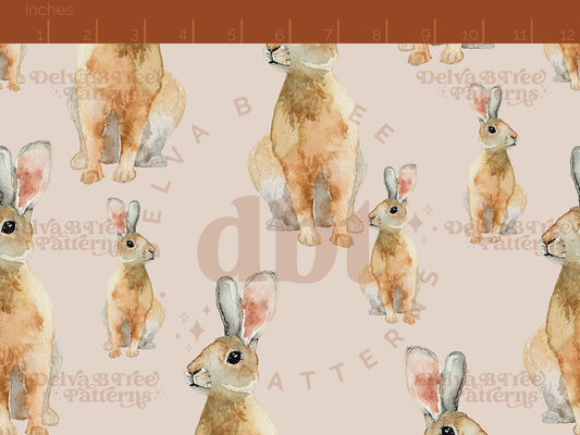 Watercolor bunnies on a muted tan background seamless pattern scale digital file for small shops that make handmade products in small batches.