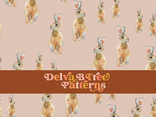 Watercolor bunny rabbits on a blush pink background seamless file for fabric printing. Retro earth tone Bunnies Repeat Pattern for textiles, polymailers, baby girl lovey blankets, nursery crib bedding, kids clothing, girls hair accessories, home decor accents, pet products.